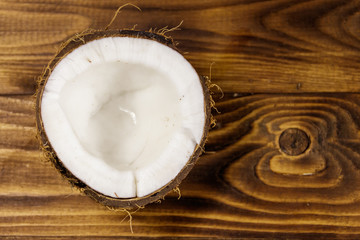 Fresh ripe coconut on rustic wooden table