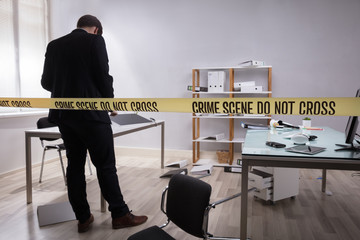 Investigator Collecting Evidence In Office