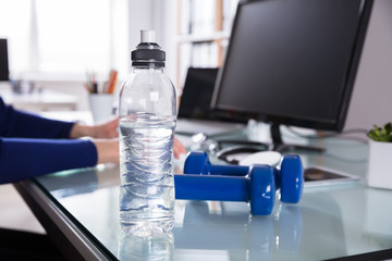 Close-up Of Water Bottle And Dumbbell