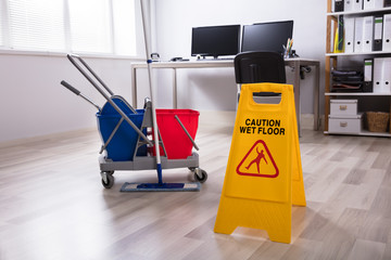 Wet Floor Caution Sign On Floor