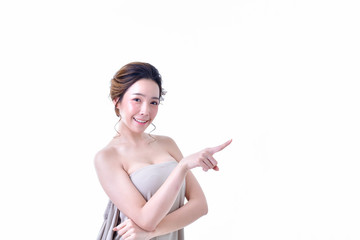 The concept of healthy beautiful woman. Beautiful women keep healthy. Beautiful women are present. Beautiful woman pointing fingers on white background.