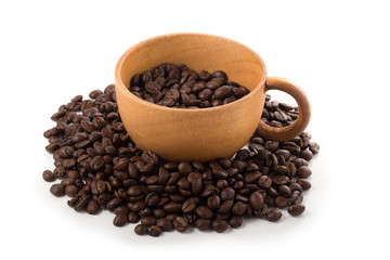Coffee beans in wooden cup ioslated on a white background