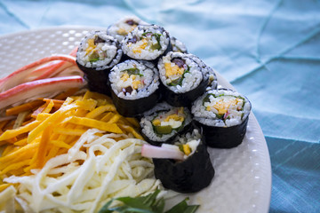 Kimbap filled with vegetables, egg and ham