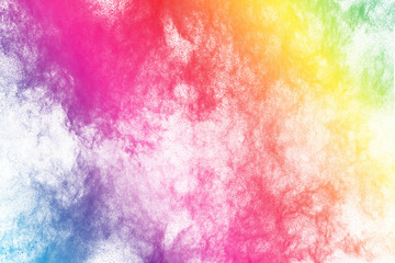 Abstract  colored dust explosion on white background.Abstract color powder splattered background
