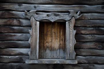 Wooden wall with a window.