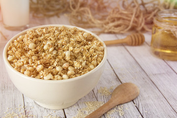 Cooked whole porridge oats in white ceramic bowl.Healthy breakfast.Oatmeal
