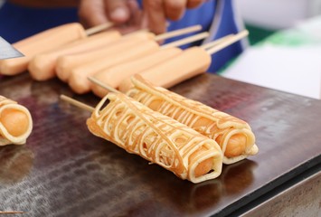 Pancake with sausage at street food