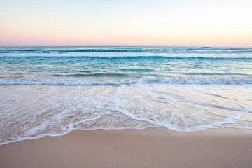 Fototapeta na wymiar Ocean Waves on Sand Beach