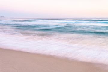 Fototapeta na wymiar Ocean Waves on Sand Beach