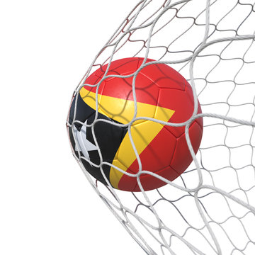 East Timor East Timorese flag soccer ball inside the net, in a net.