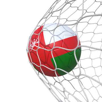 Omani Oman flag soccer ball inside the net, in a net.