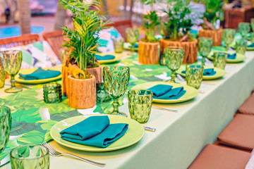 Table setting in a restaurant at a tropical party