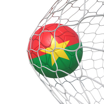 Burkina Faso flag soccer ball inside the net, in a net.