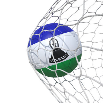 Lesotho flag soccer ball inside the net, in a net.