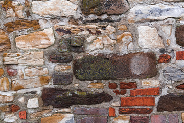 The colored stones in the old wall of the fortress