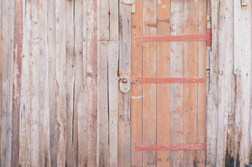 Grey wooden wall from old boards with door
