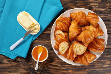 hot freshly baked croissants on platter