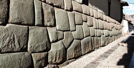 Hatun Rumiyoc street with Incan twelve angle stone in Cusco, Peru. - obrazy, fototapety, plakaty