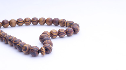 Closeup of  tasbih or rosary on a white background. Selective focus and copy space.