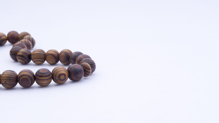 Closeup of  tasbih or rosary on a white background. Selective focus and copy space.