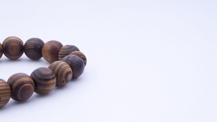 Closeup of  tasbih or rosary on a white background. Selective focus and copy space.