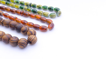 Closeup of  tasbih or rosary on a white background. Selective focus and copy space.