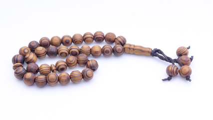 Closeup of  tasbih or rosary on a white background. Selective focus and copy space.