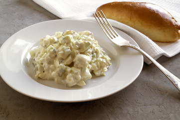 Classic egg salad on a white plate.