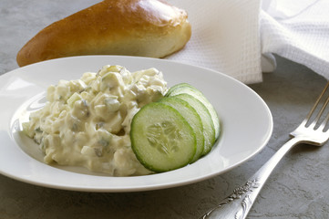 Traditional American egg salad on grey background.
