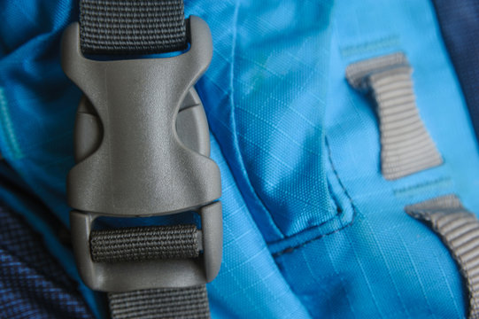 closed grey fastex buckle of trekking backpack