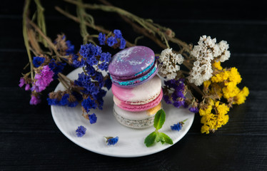 Macaroons with flowers. Close up macaroons.