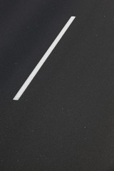 Asphalt road with white mark line.