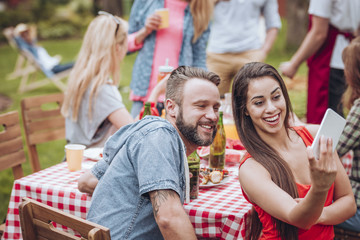 Smiling woman taking photo