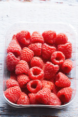 Raspberries on wooden background
