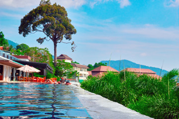 Landscape of a tropical resort. Outdoor swimming pool of the hotel.