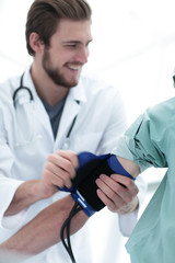 Blood pressure measuring. Doctor and patient.