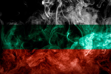 National flag of Bulgaria from thick colored smoke on a black isolated background