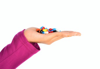 Top view of the pills on the hand and white background, A hand hold the pills and drug, Pile of the drug and pills on the hand.