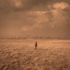 Single girl at vastness as loneliness and freedom concept