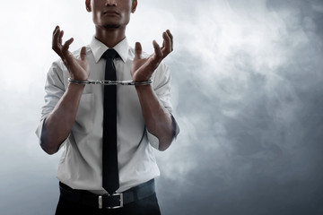 Businessman in handcuffs