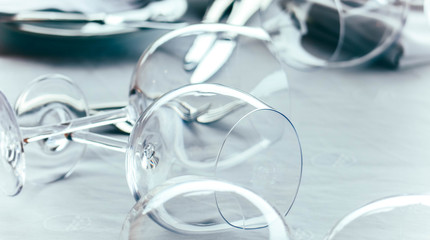 Elegant served table of luxury restaurant, vine glasses and napkin close up