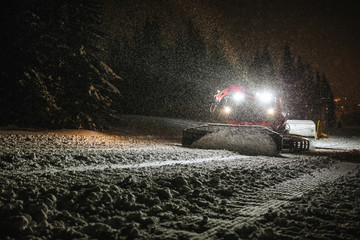 snow machine cleaning snow in dark