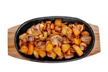 Potato with mushrooms and onions, fried, baked portion on a hot frying pan, on a wooden board on a white isolated background view from above. For the menu, restaurant, bar, cafe