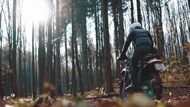 travel motorcycle off road Motorcyclist ride in autumn forest, A motorcycle driver, adventure concept, active lifestyle, enduro, dual sport touring