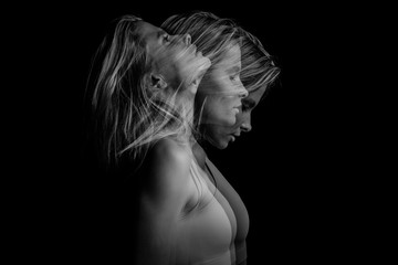 Beautiful dramatic phantom mystical mysterious ambiguous original conceptual profile side portrait of young blonde woman on a black background. Black and white photo. triple exposure. - obrazy, fototapety, plakaty