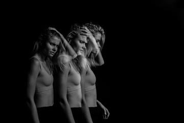 Offended, aggressive, rancorous look of the girl. original conceptual dramatic portrait on a black...