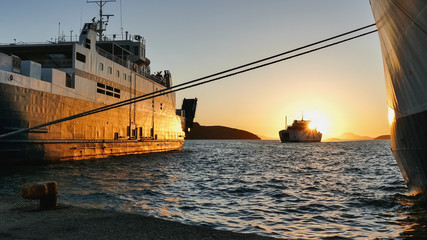 Beautiful golden sunset in the port of Igoumenitsa © d_zheleva