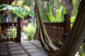 Hammock on the terrace of a villa in the jungle