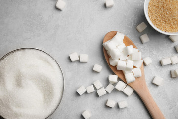 Composition with various kinds of sugar on gray background