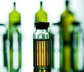 Group object of liquid medicinal agent in limpid glassware in medical laboratory. Group of ampoules with a transparent medicine in medical laboratory